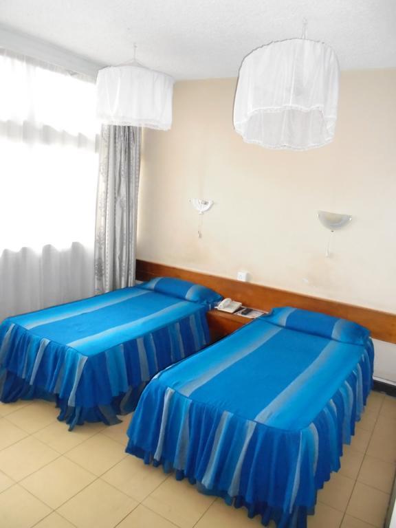 Karibu Hotel Найробі Номер фото